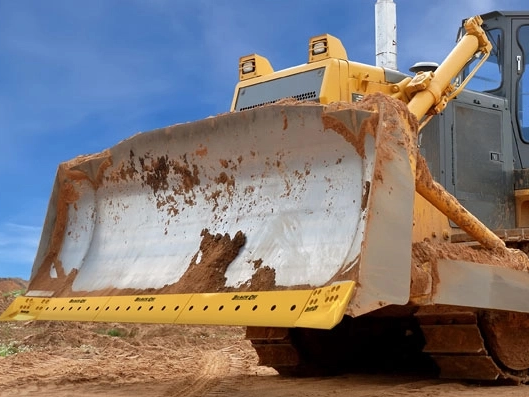 Cómo el material de la vanguardia del toser afecta el rendimiento de la excavadora
